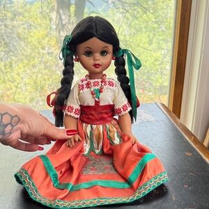 Cultural Heritage Doll with Braided Hair and Red Dress